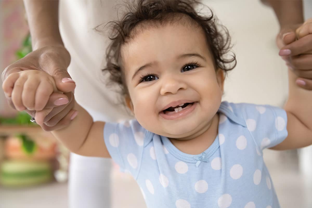 Baby being held hands image